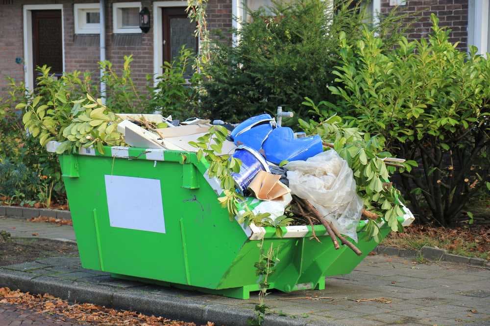 loaded-dumpster-near-construction